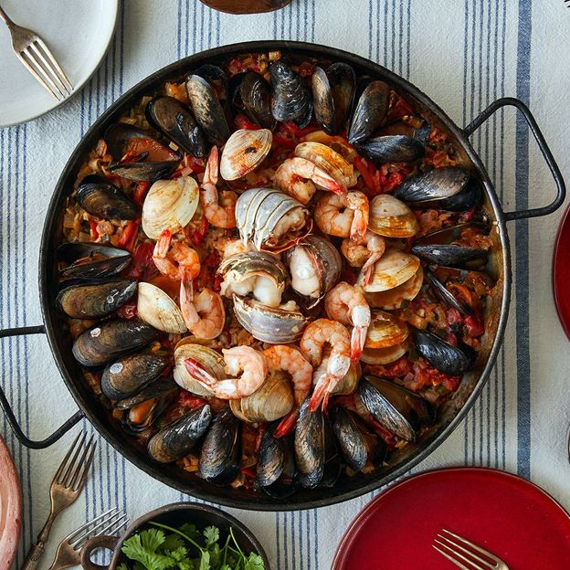 The Simple Art of Rice Seafood paella with lime BBC Travel