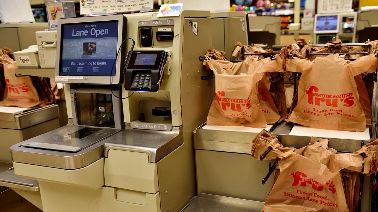 Self-service: Booths supermarket puts staff back behind its tills - BBC News