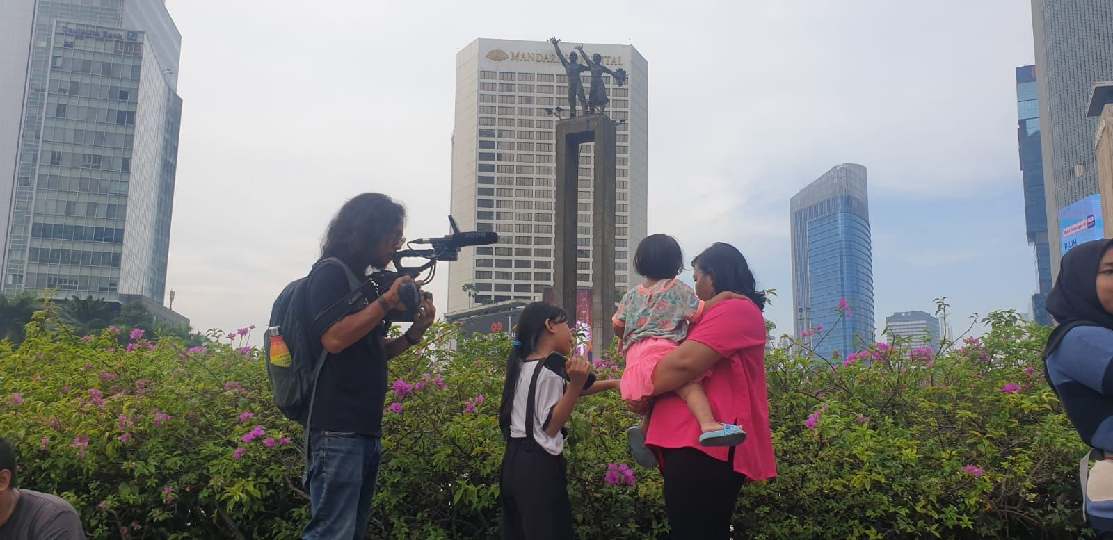 Film crew with family in city