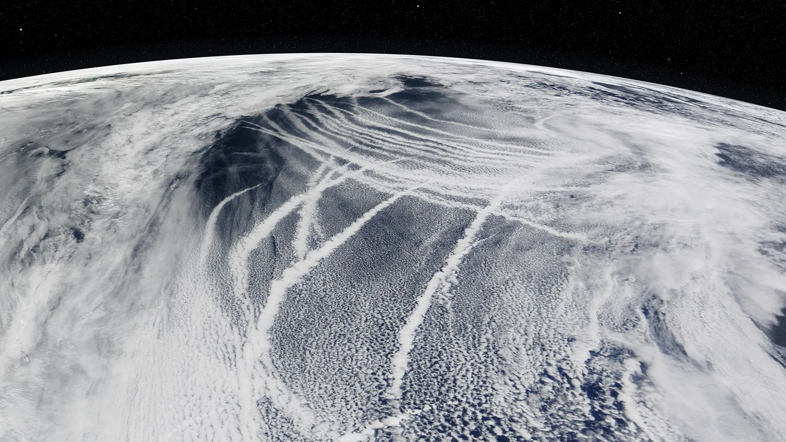 Pollutions trails left by ship viewed from a satellite brightening clouds.