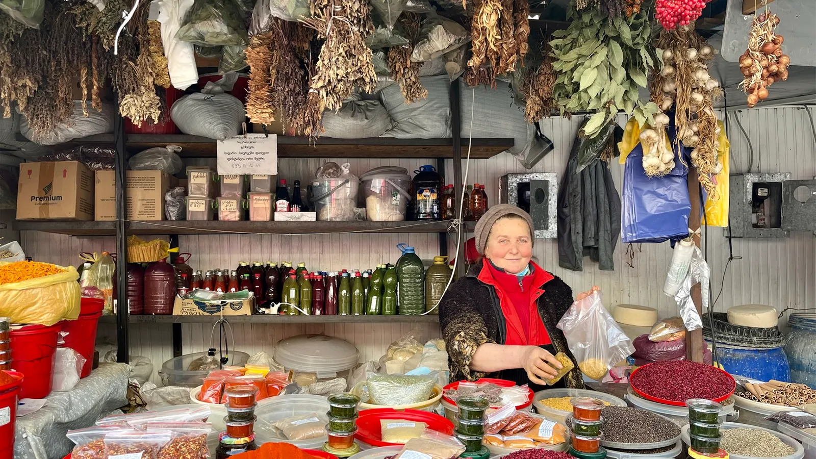 Louisa Valerangovna sells spices at her stall in Tbilisi’s Dezerter Bazaar (Credit: Sarah Freeman and BBC)