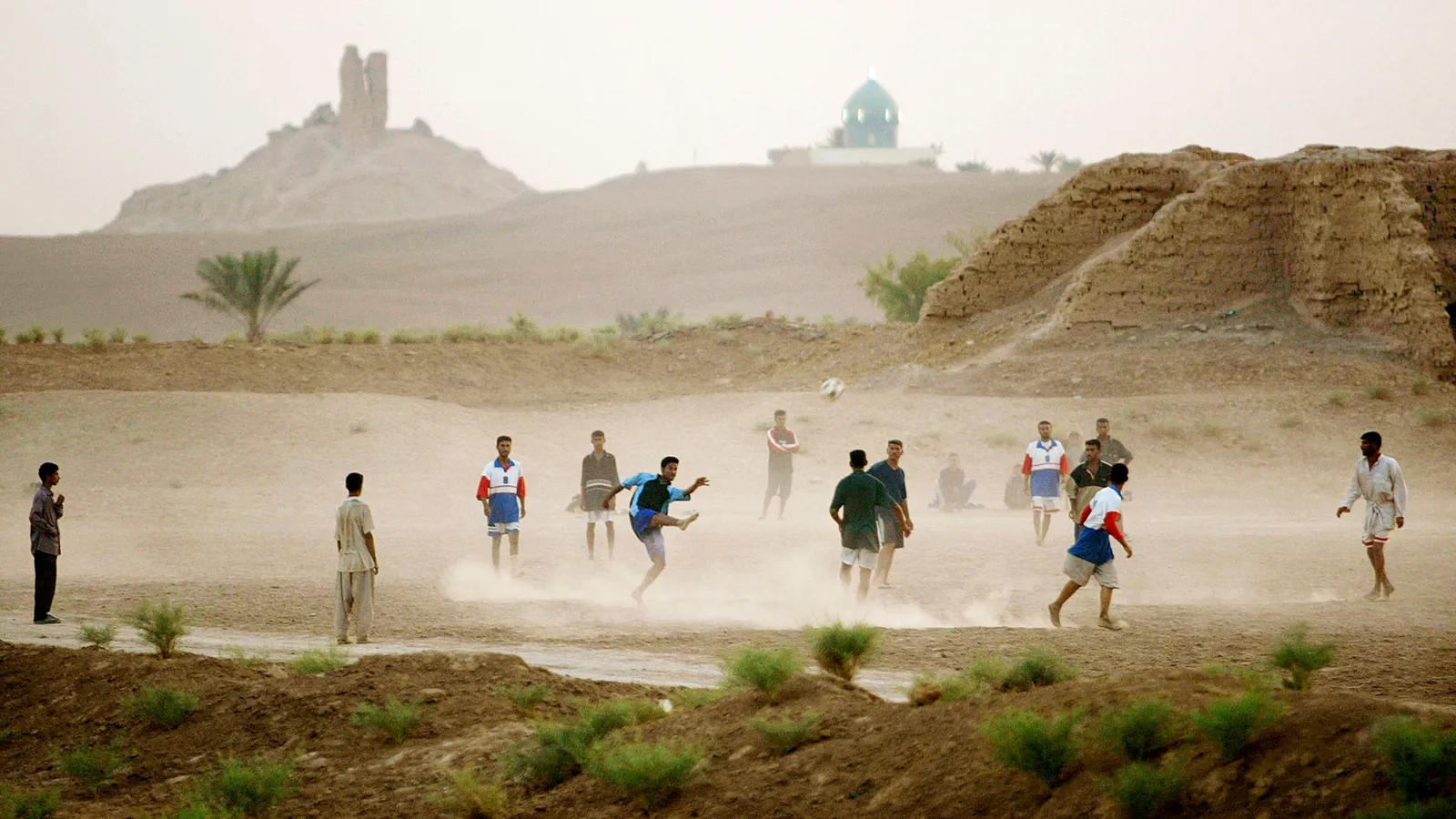 Young Iraqis play soccer in the shadow of the ruins of a ziggurat in Borsippa, Iraq (Credit: Mario Tama/Getty Images) Young Iraqis play soccer in the shadow of the ruins of a ziggurat in Borsippa, Iraq (Credit: Mario Tama/Getty Images)