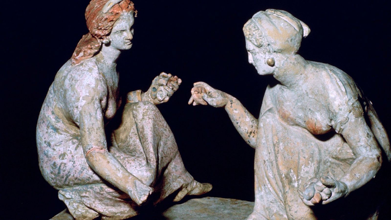 Girls play with knucklebones, an ancient game (Credit: Getty Images)