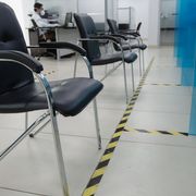 Chairs spaced by tape in a bank in Moscow, Russia on 8 April 2020 thumbnail