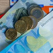 Cash and German bank cards on 25 March 2020 thumbnail