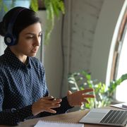 File image of a woman talking into a laptop thumbnail