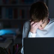 Unhappy woman staring at laptop thumbnail