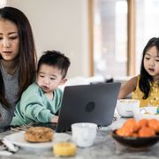 woman trying to work while caring for children thumbnail