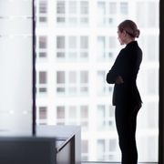 Office worker looking out of a window thumbnail