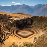The Incan agricultural site of Moray with mountains in background thumbnail