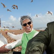 Black senior citizens having fun on a beach (Credit: Getty) thumbnail