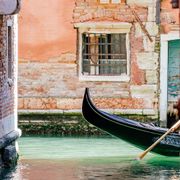 Gondola in canal in Venice, Italy thumbnail