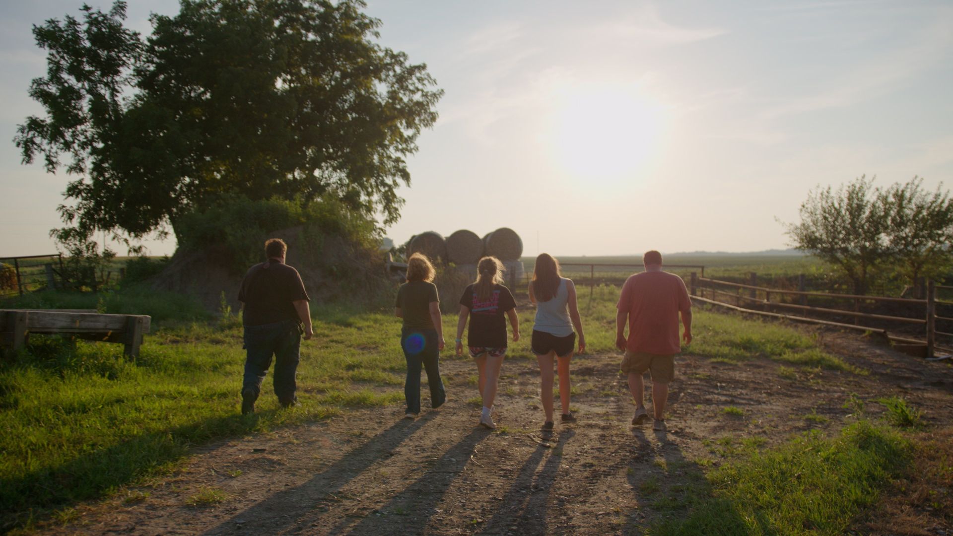 Family walking into the sunset