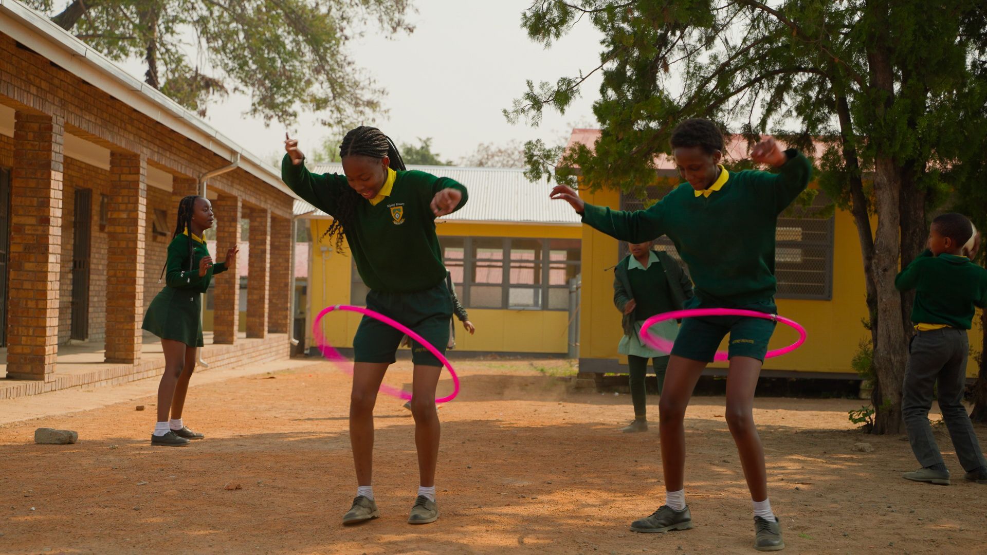 Two girls playing with hoops