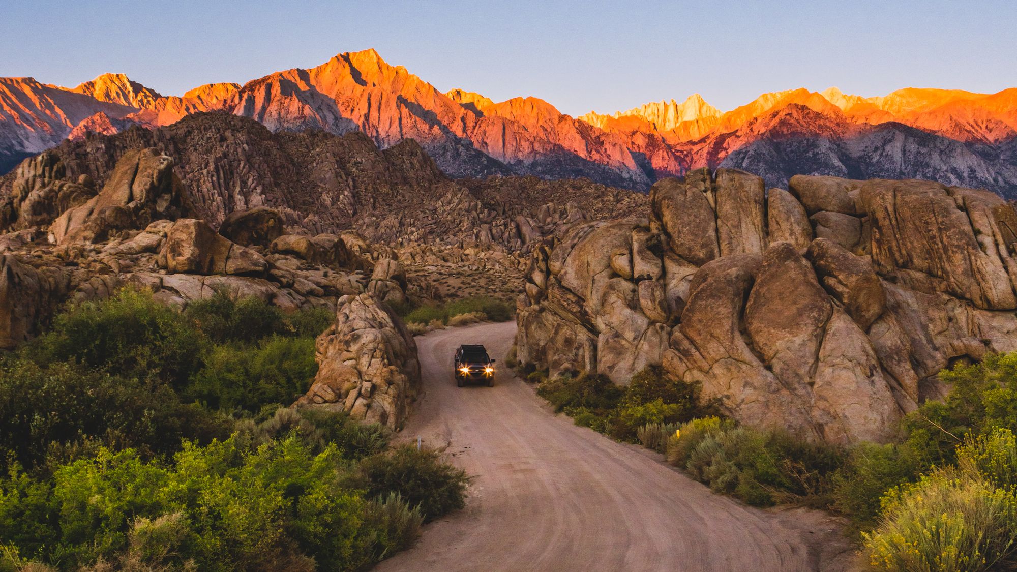 A new age of post-pandemic travel - van driving through mountains A new age of post-pandemic travel - van driving through mountains