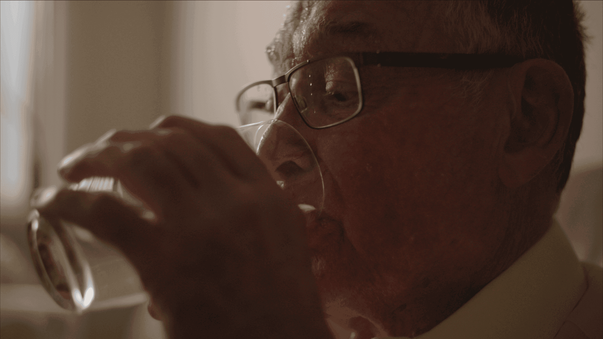 Man drinking a glass of water