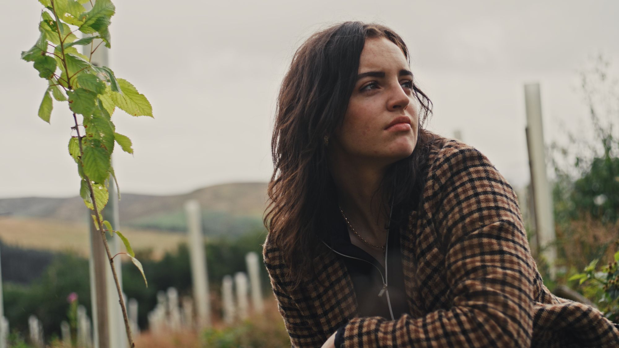 A woman is looking out into the distance A woman is looking out into the distance