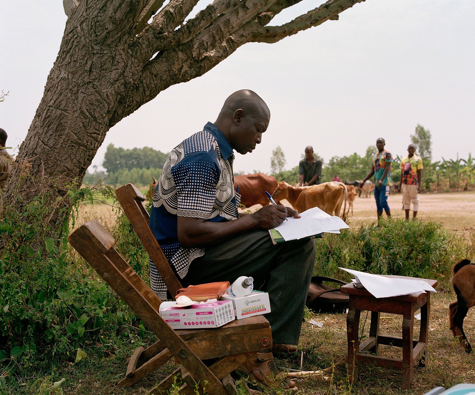 Seated man writing