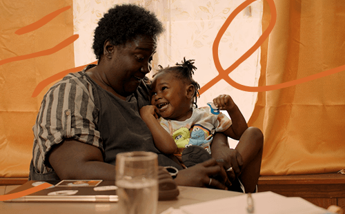A woman and toddler laughing