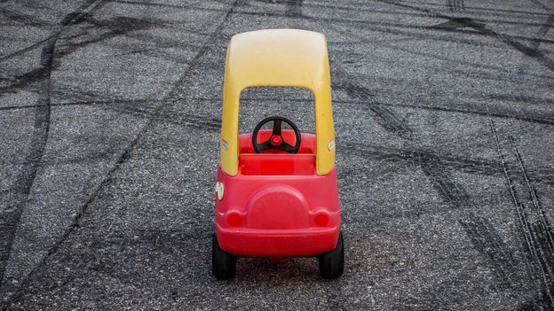 red toy car with yellow roof