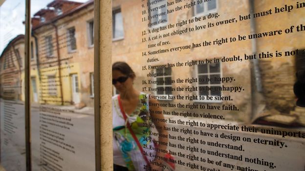 Translations of Užupis’ constitution are engraved on mirrored panels that line the Avenue of Constitutions (Credit: Credit: Christian Harberts/Alamy) Translations of Užupis’ constitution are engraved on mirrored panels that line the Avenue of Constitutions (Credit: Credit: Christian Harberts/Alamy)