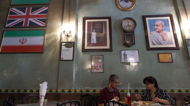Britannia & Co Restaurant, with its Union Jack flag and image of Queen Elizabeth II, is one of Mumbai's most famous Irani cafes (Credit: Credit: Indranil Mukherjee/Getty Images) Britannia & Co Restaurant, with its Union Jack flag and image of Queen Elizabeth II, is one of Mumbai's most famous Irani cafes (Credit: Credit: Indranil Mukherjee/Getty Images)