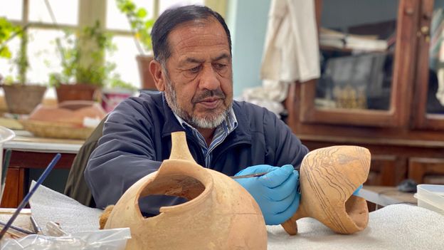 Shirzuddin Saifi is one of the conservators working to piece back together the 2,500-year-old artefacts the Taliban shattered (Credit: Credit: Hikmat Noori)