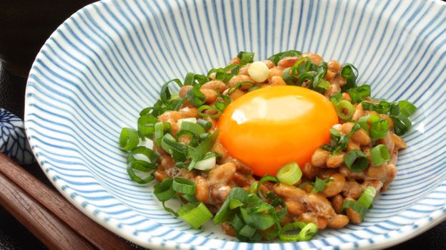 Nattō is a fermented soy-based food that’s often served with spring onion and raw egg (Credit: Credit: Hungryworks/Getty Images)