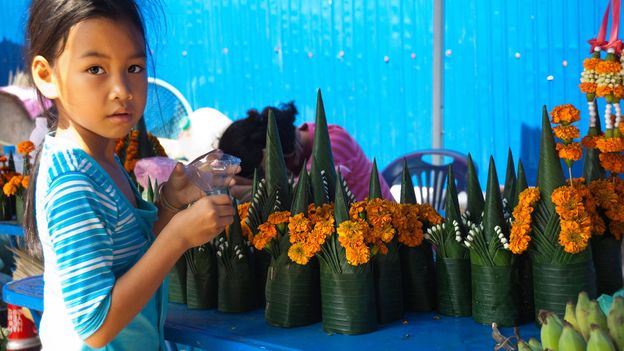 A flower montage made of banana leaves and French marigolds is part of the baci ceremony (Credit: Credit: Anne-Marie Palmer/Alamy) A flower montage made of banana leaves and French marigolds is part of the baci ceremony (Credit: Credit: Anne-Marie Palmer/Alamy)