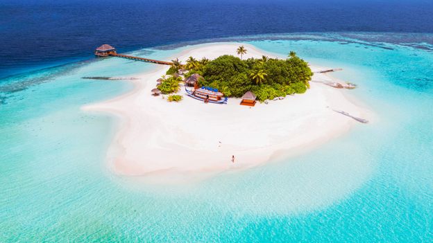 The low-lying Maldives islands are threatened by rising ocean levels due to climate change (Credit: Credit: Matteo Colombo/Getty Images)