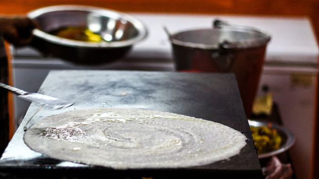 Dosai is a thin South Indian pancake made from a fermented batter of soaked rice and black gram (Credit: Credit: Anindam Ghosh/EyeEm/Getty Images)