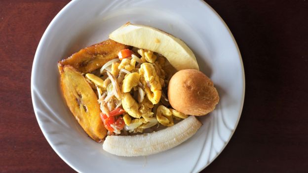 Ackee and saltfish is often served with sides like roasted breadfruit, johnnycake and pan-fried plantain (Credit: Credit: Brendan Sainsbury)