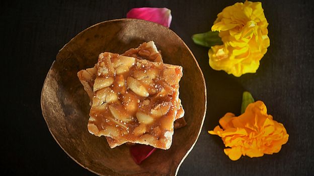 Chikki (peanut or sesame infused jaggery brittle) is a beloved sweet snack for many South Asians (Credit: Credit: Veena Nair/Getty Images) Chikki (peanut or sesame infused jaggery brittle) is a beloved sweet snack for many South Asians (Credit: Credit: Veena Nair/Getty Images)