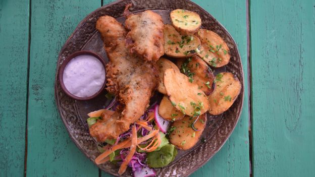 Mapuche chef José Luis Calfucura serves up fried fish with native potatoes and maqui-infused mayonnaise at Amaia (Credit: Credit: Mark Johanson)