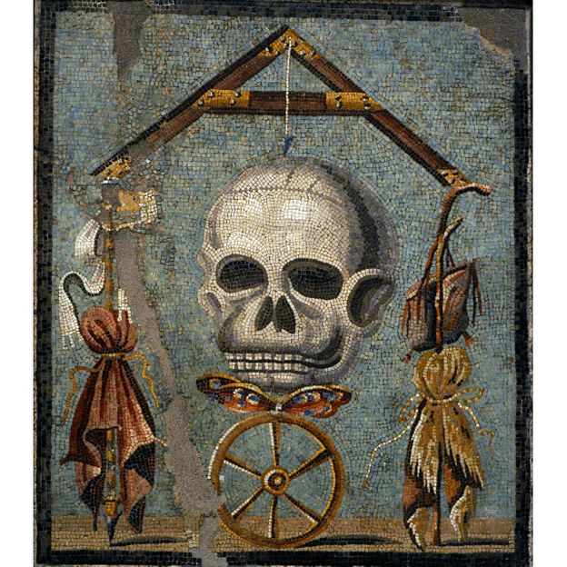 A butterfly between the skull and wheel on this Roman mosaic from 30BC-14C symbolises the human soul (Credit: Alamy) A butterfly between the skull and wheel on this Roman mosaic from 30BC-14C symbolises the human soul (Credit: Alamy)