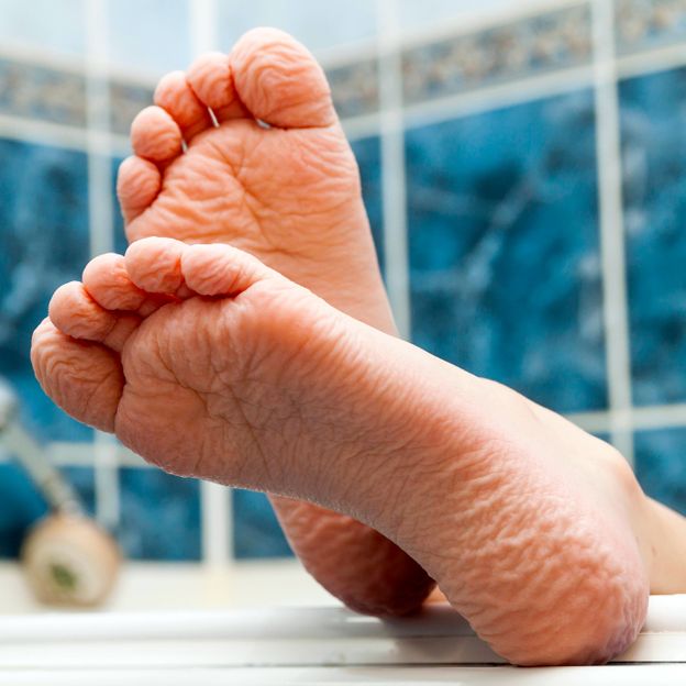 The skin on our feet and hands shrivel and wrinkle in the bath, while other parts of our body do not undergo the same transformation (Credit: Andrii Biletskyi/Alamy)