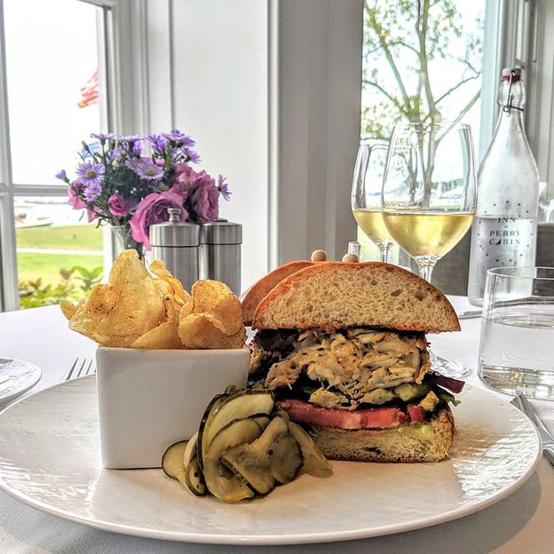 Stars's Maryland Crab Sammy is garnished with tomato, spinach and lemon aioli and served on a brioche bun (Credit: Gregory James)