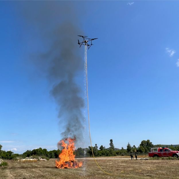 A new firefighting drone which douses flames from above is being tested in Portugal (Credit: April Reese)