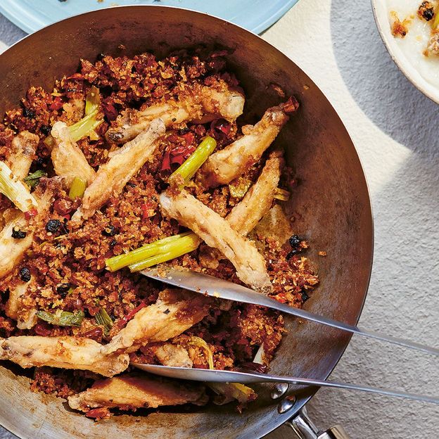 These crispy chicken wings are stir-fried with garlic, onion and chillies (Credit: Yuki Sugiara)