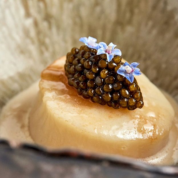 A plump, butter-seared day-boat scallop has an optional topping of caviar (Credit: Culinary Edge Group)