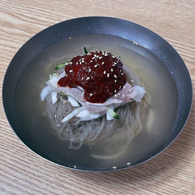 The chilled milmyeon at Naeho Naengmyeon are topped with spicy sauce (Credit: Summer Lee)