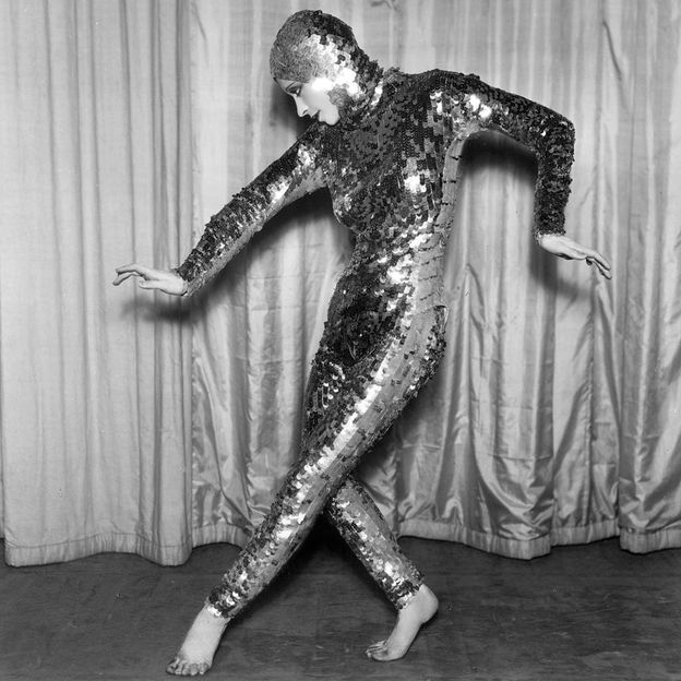 A contortionist wearing a sequinned bodysuit in the 1930s, when sequins were at their most fashionable – and volatile (Credit: Getty Images)