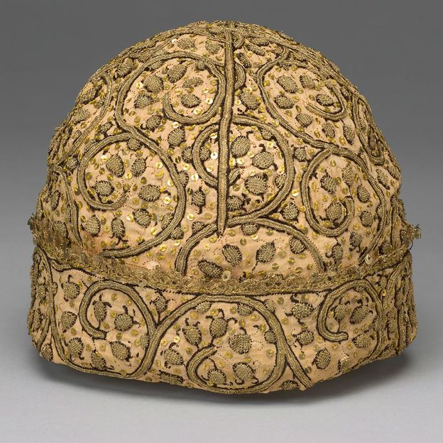 A man's sequinned cap from 16th-Century  England; they adorned the garments of wealthy families at the time (Credit: Getty Images)