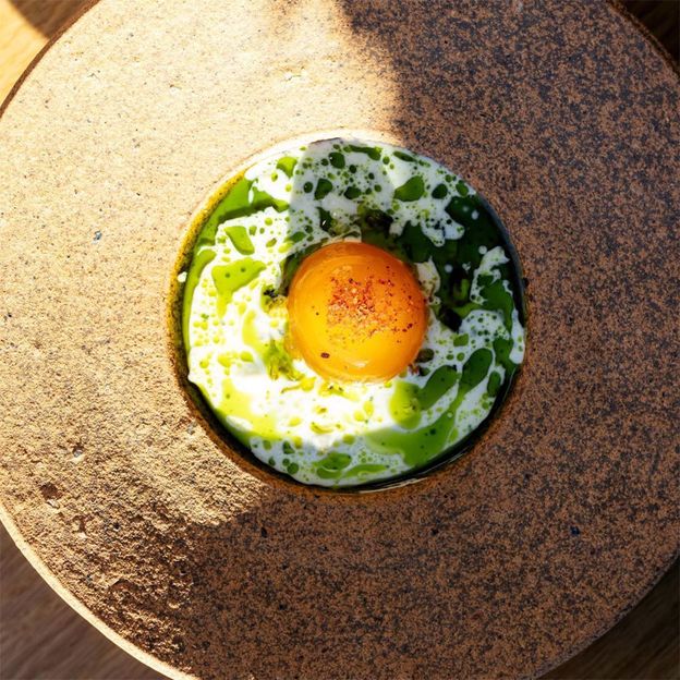 At Audrey, Jimmy Red grits and cured egg yolks are served with cream and bay laurel oil (Credit: Daniel Meigs)