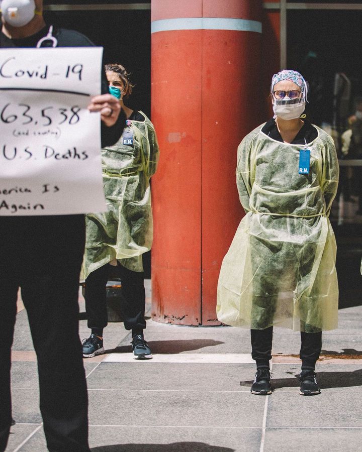 Nurses in PPE have started standing in front of crowds during recent rallies in the US as a way of challenging their protests (Credit: Getty Images)