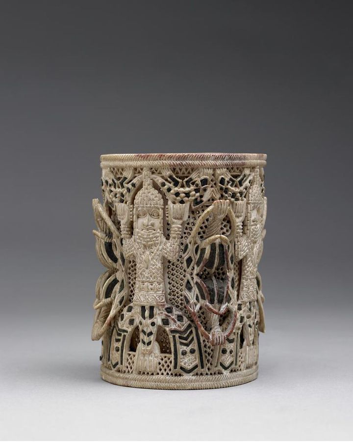 An ivory armlet depicts the Oba (king) of the African kingdom of Benin with symbolic mudfish legs (Credit: British Museum)