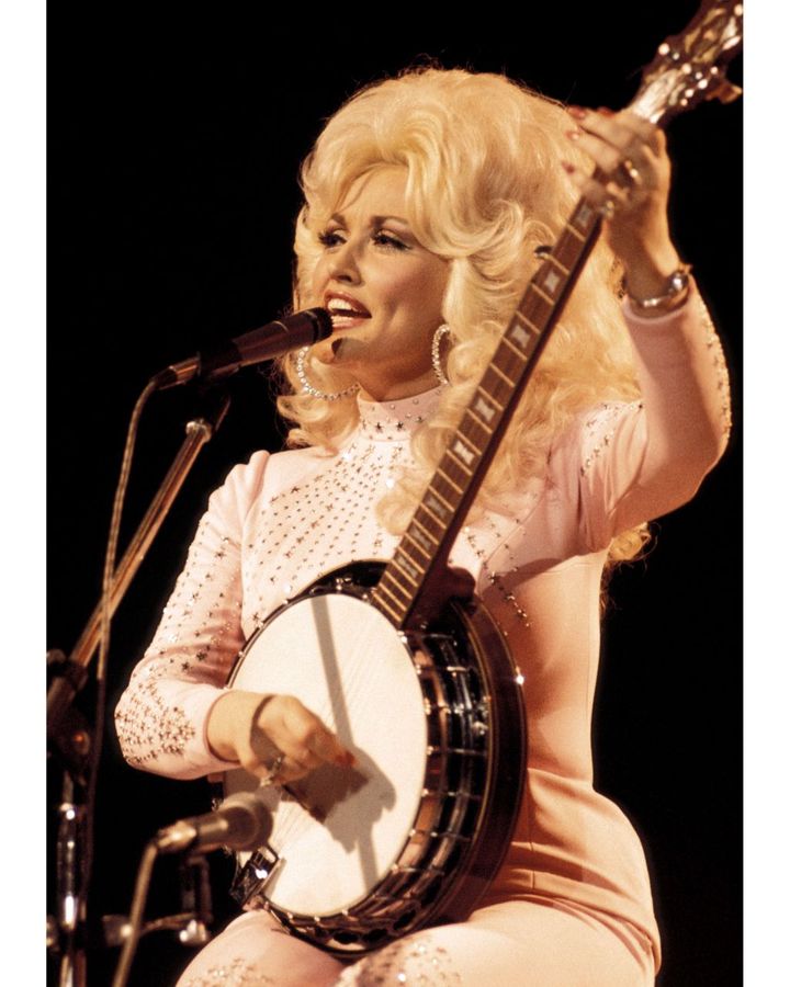 Parton took on a more glamorous image and more commercial material in the mid-1970s (Credit: Getty Images)