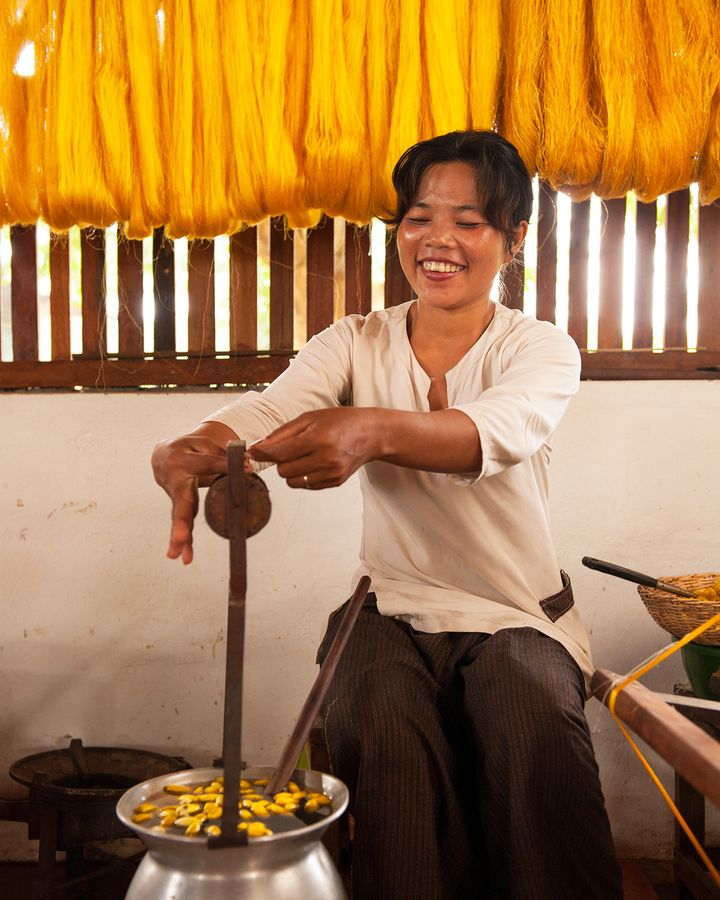 At Golden Silk Pheach, workers unravel silk from the cocoons and later spin it onto bobbins (Credit: Golden Silk Pheach) At Golden Silk Pheach, workers unravel silk from the cocoons and later spin it onto bobbins (Credit: Golden Silk Pheach)