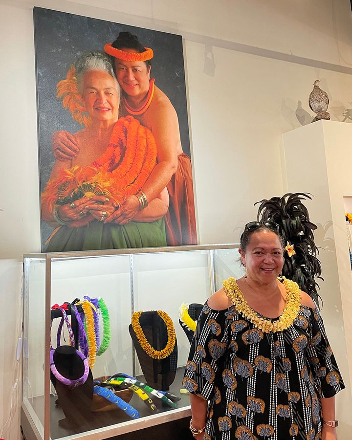 Chun is shown in her shop in front of a portrait taken with her grandmother (Credit: Erinne Magee)