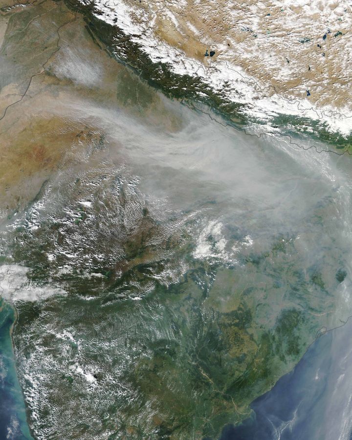 The smoke from burning crop fields in autumn is visible from space, covering swathes of Northern India (Credit: Nasa Earth Observatory/Lauren Dauphin)